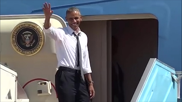 Obama waving goodbye before embarking to Washington