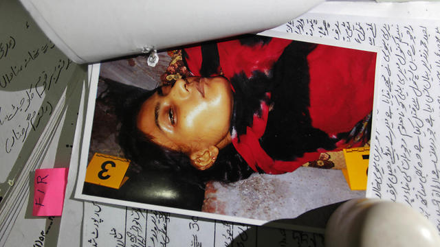 A picture of Tasleem, who was shot by her brother, is seen with records at police headquarters in Lahore (Photo: AP)