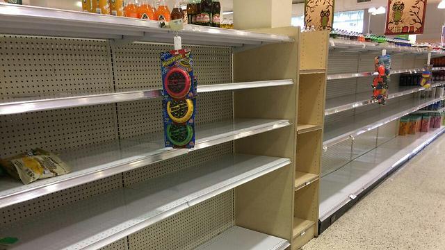 As Florida residents stock up and prepare for the worst, supermarket shelves empty