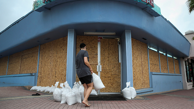 Business owners board up their premises and hope for the best (Photo: AP) (Photo: AP)