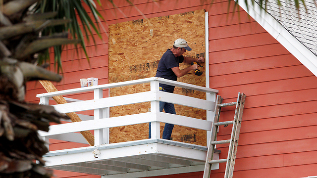 Businesses brace themselves for the storm (Photo: Reuters)