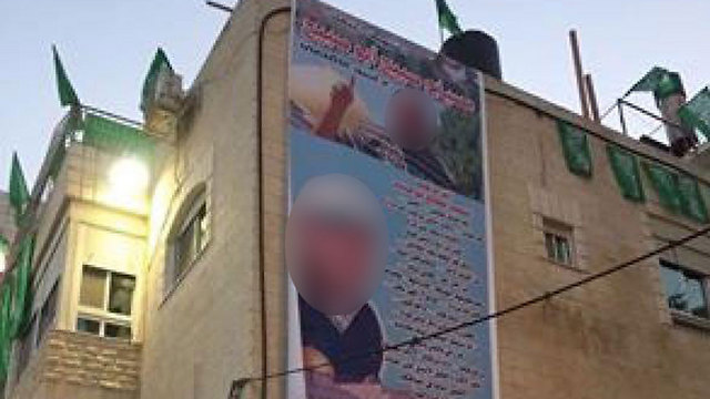 Picture of the terrorist hung on buildings in Jerusalem