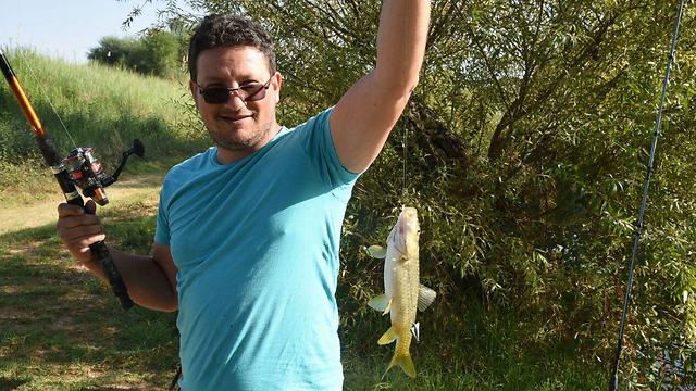 Catching a fish in the Upper Galilee (Photo: Avihu Shapira)
