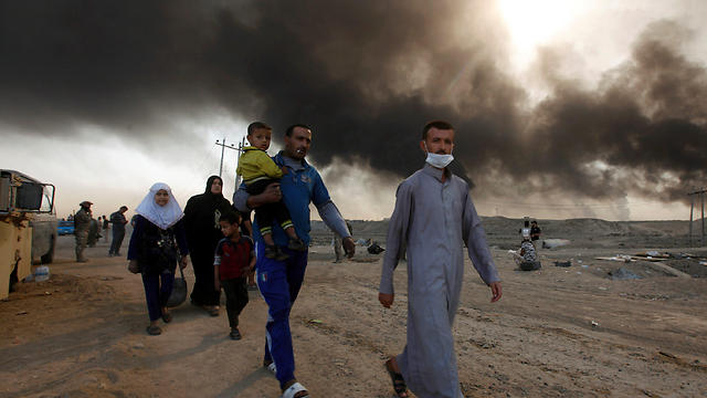 Families fleeing from burning sulphur (Photo: Reuters