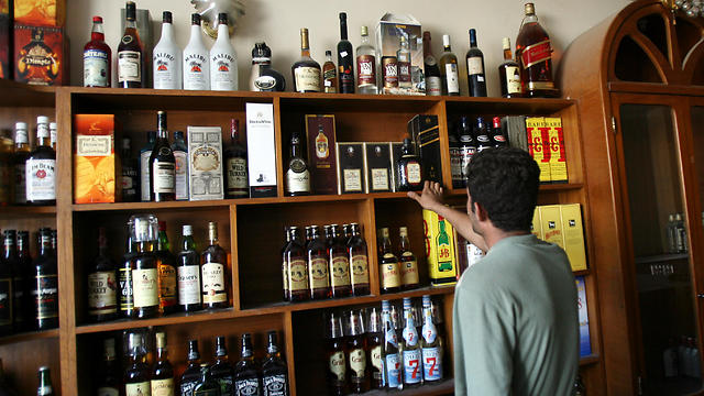 In this Sept. 11, 2007, file photo, a man looks at bottles of alcohol on sale in liquor store in Baghdad, Iraq. (Photo: AP)
