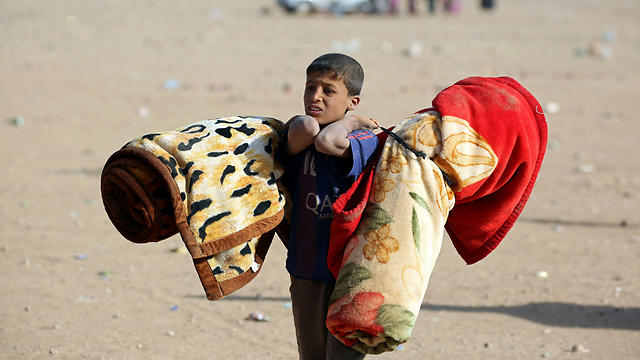 פליטים שברחו ממוסול (צילום: AFP) (צילום: AFP)
