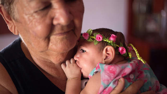 Ana Beatriz, a baby girl with microcephaly, celebrates four months in Lagoa do Carro, Pernambuco, Brazil (Photo: EPA)