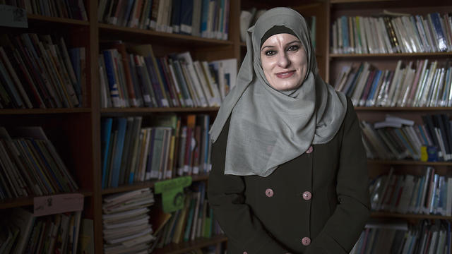 Reema Shamasneh poses for a photo in the office of her legal aid center in Ramallah (Photo: AP)