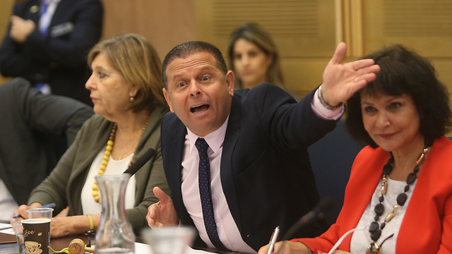 MK Eitan Cabel (center) from the Zionist Union at the Economic Affairs Committee Photo: Alex Komoloisky)