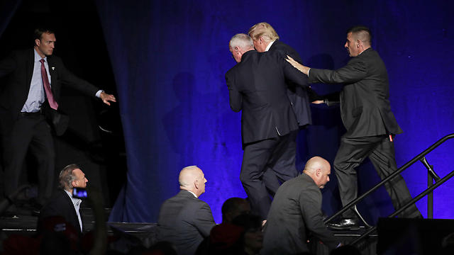 Donald Trump being escorted by security after gun threat (Photo: AP)