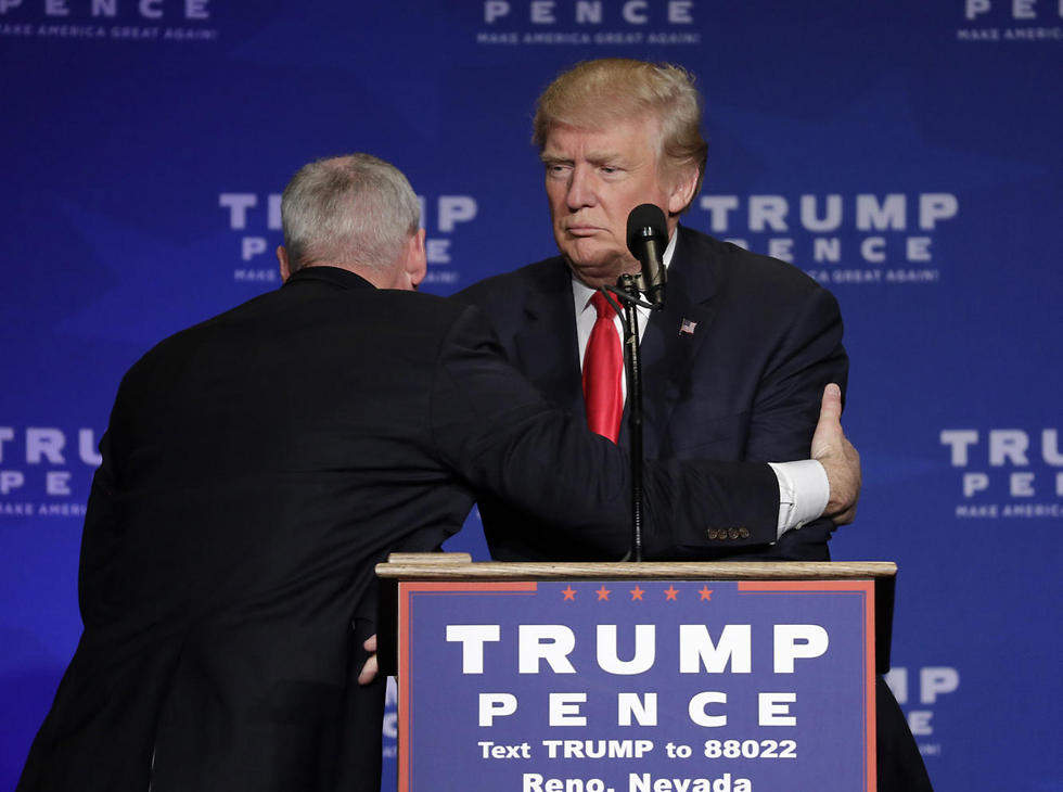 Trump being pulled away after reports of a gun in the room (Photo:AP)