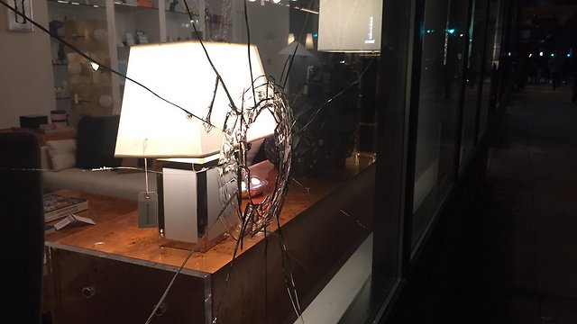 Damage done to storefront by anti-Trump protestors