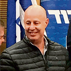 Tzachi Hanegbi wearing the jacket at the meeting where Netanyahu criticized him for it.
