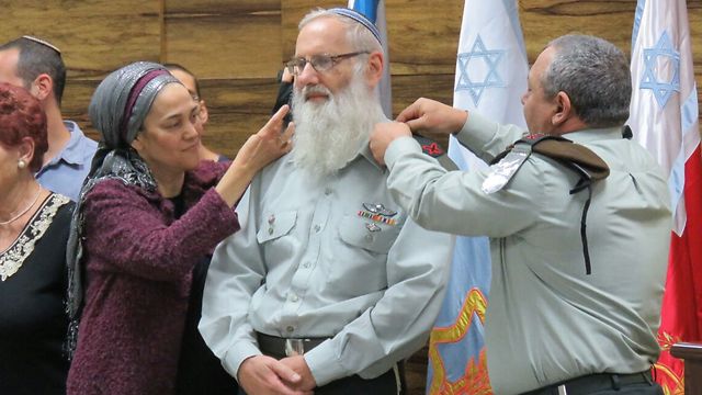 Karim (C) receiving his new rank from IDF Chief of Staff Gadi Eizenkot (R)