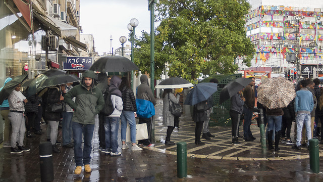Umbrellas out in Netanya (Photo: Ido Erez)
