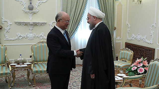 IAEA chief Amano meets with Iranian President Rouhani (File photo: AP)