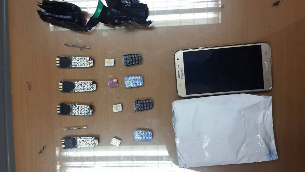 Some of the phones Ghattas was caught smuggling into prison.