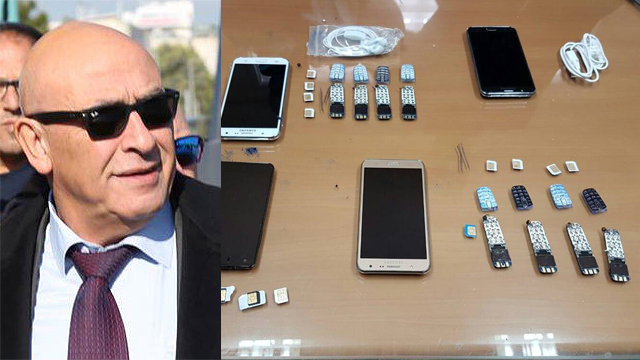 MK Ghattas with some of the phones he allegedly smuggled (Photo: Motti Kimchi)