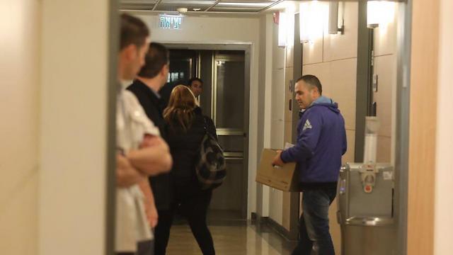 Investigators leaving Ghattas's office with boxes of documents (Photo: Knesset Spokesman's Office)