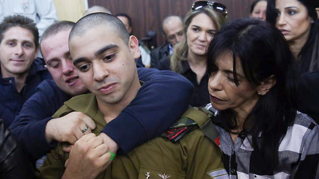 Sgt. Azaria with his mother in court (Photo: Flash90)