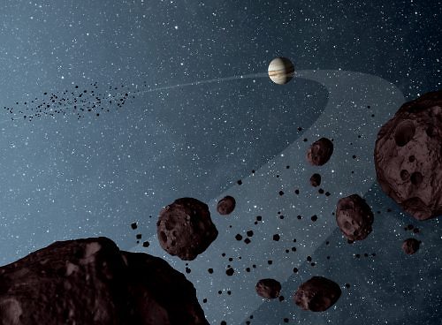 הדמייה של שתי קבוצות האסטרואידים הטרויאנים ה"עוקבים" מלפנים ומאחור את כוכב הלכת צדק במסלולו סביב השמש (צילום: נאס"א)