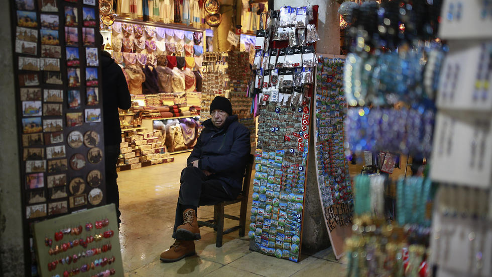 A vendor waits for customers in Istanbul's Grand Bazaar, one of Istanbul's main tourist attractions. (Photo: AP)