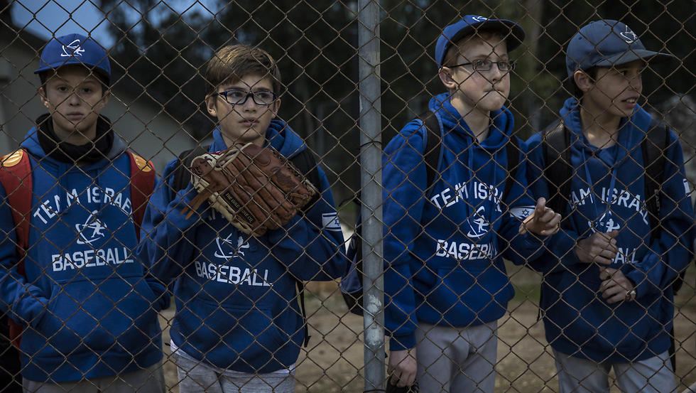 Young players watch American Jewish professional baseball players practice at the Baptist Village sport complex near Petah Tikva. (Photo: AP)