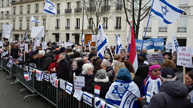 Protestors outside the conference (Photo: AFP)