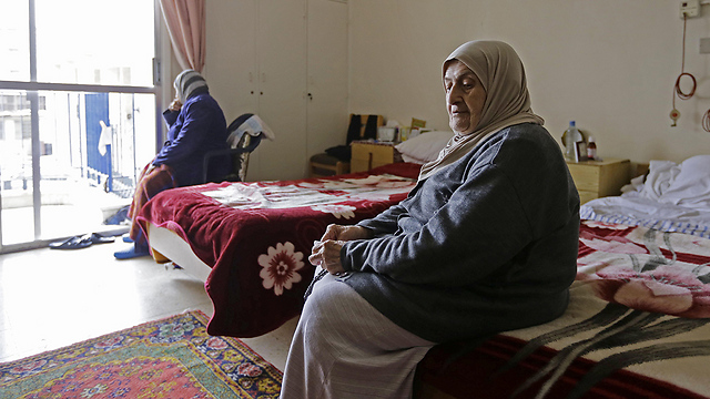 לא ציפתה לבלות את שארית חייה בצפייה בתמונות הילדים שלה. נאז עאשיטי (צילום: AFP) (צילום: AFP)
