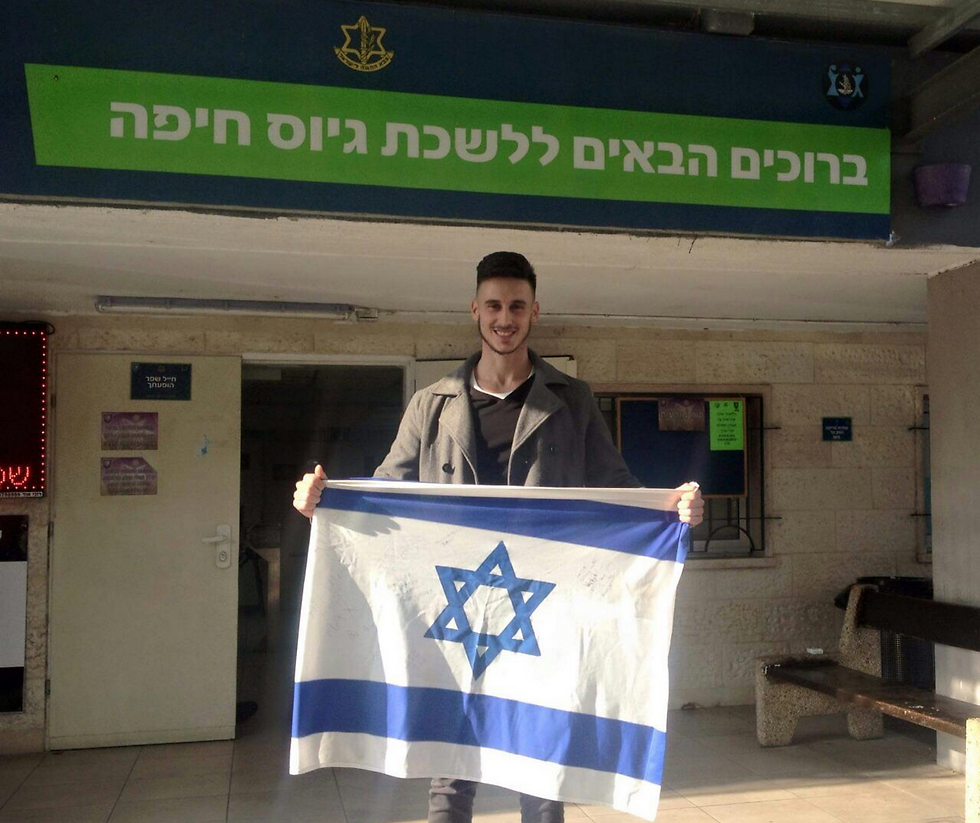 Hirshfield outside the Haifa enlistment office showing his colors