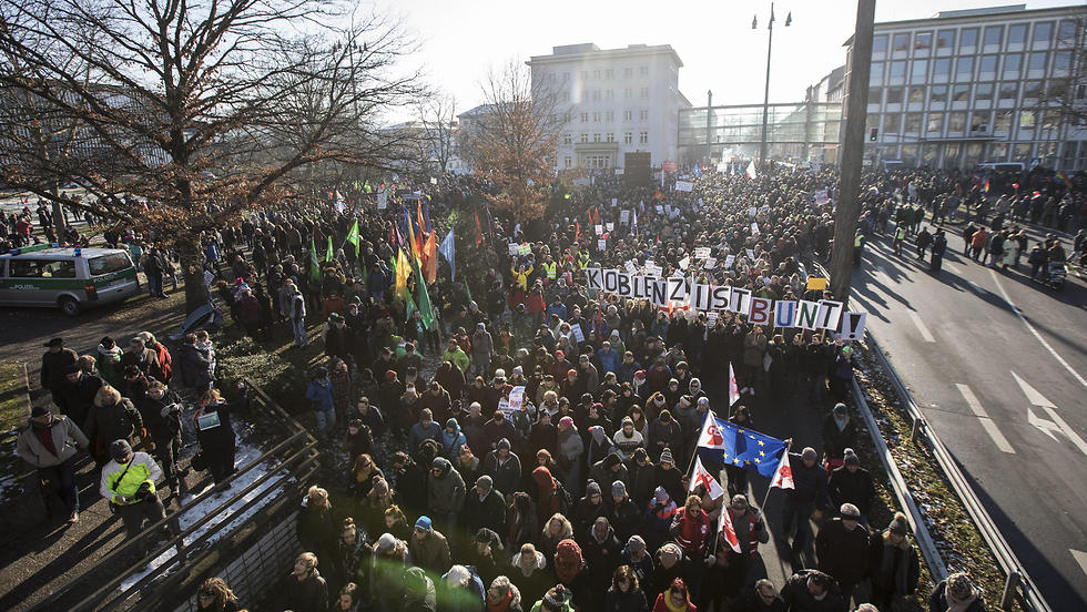 Protesters present banners reading: 'Koblenz is colorful' during a demonstration against the conference of European right-wing party ENF. (Photo: EPA)