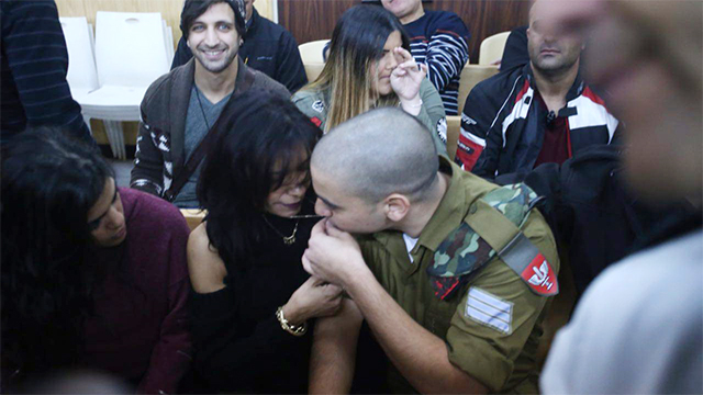 Elor Azaria in court with his mother (Photo: Motti Kimchi)