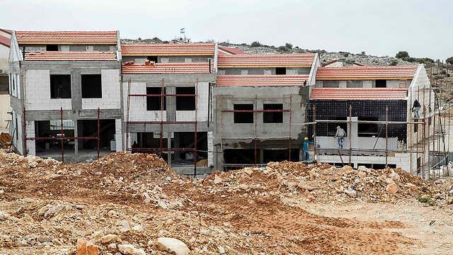 בנייה באריאל. טרם הוגדלה מכסת העובדים הפלסטינים בענף (צילום: AFP) (צילום: AFP)