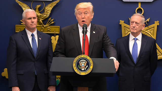 L to R: Pence, Trump and Mattis (Photo: AFP)