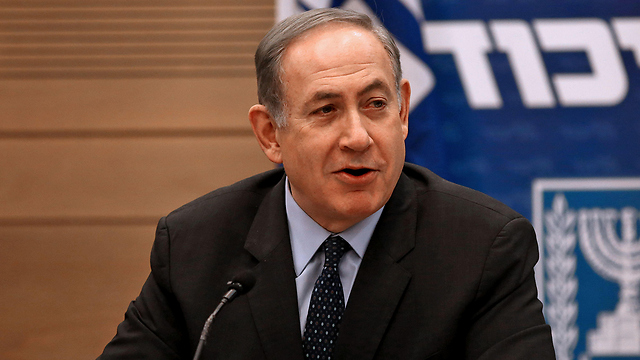 Netanyahu at a Likud party meeting (File photo: AFP)