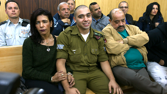 Azaria with his parents in court (Photo: Abigail Uzi)