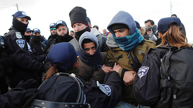 Police attempt to remove activists (Photo: AFP) (Photo: AFP)