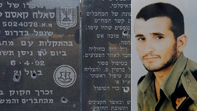 Sergeant Tafesh and the defaced monument (Photo: Gil Nechushtan)