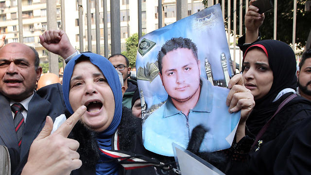 Relatives of victims killed in a riot following a football match in Port Said in February 2012, react outside the courthouse in Cairo, Egypt (Photo: EPA)