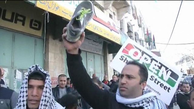 Issa Amr speaking at Hebron protest (Photo: Reuters)