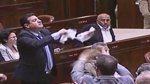 Ayman Odeh tears up the bill from the floor (Credit: Knesset Channel)