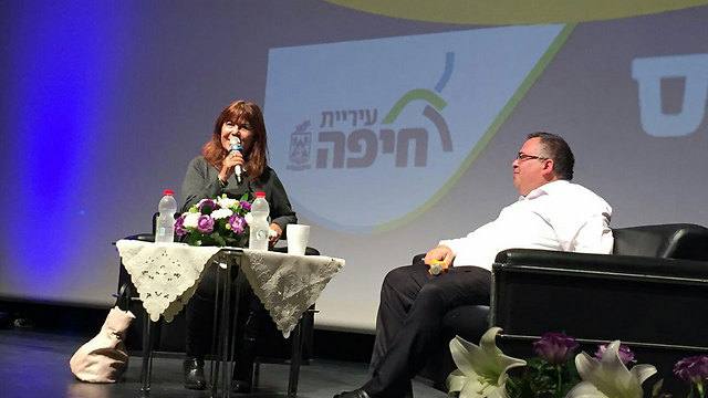 Bitan (R) being interviewed at the event by journalist Rina Matzliach