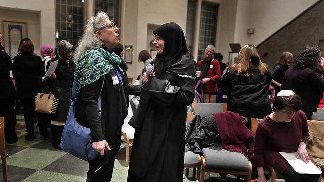Members of the Sisterhood Salaam Shalom talk after a unity vigil held at the Jewish Theological Seminary in New York (Photo: AP)