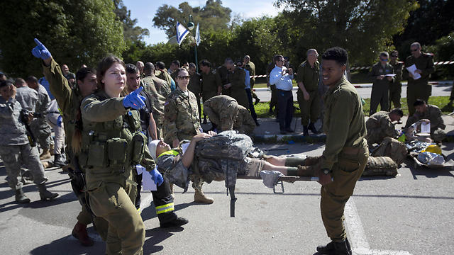 American servicemen and Israeli soldiers participate in a joint drill simulating a rocket attack at a base in Hatzor (Photo: AP, file photo)