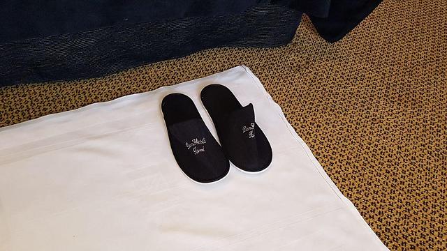 Smaller slippers in a Dan Hotel (Photo: Amit Cotler)