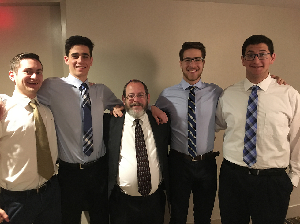 The winning team: (L-R) Yehonatan Vloski, Coby Strell, Dr. Joshua Moss, Samuel Goldberg, and Isaac Ostrow (Photo: Courtesy of The American Hebrew Academy)