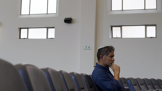 Franklin Perez, listens to a rabbi at a synagogue in Bogota, Colombia (Photo: AP)