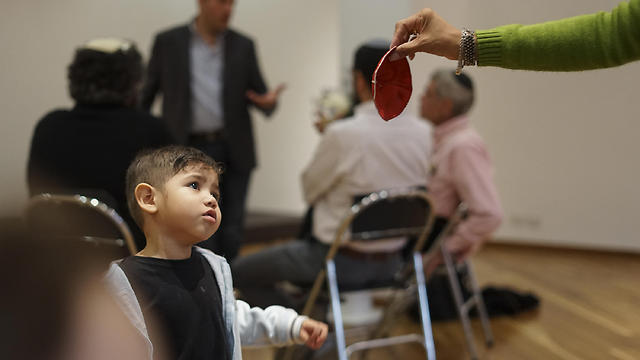 Ezra Perez, 3, handed a kippah at a synagogue in Bogota (Photo: AP)