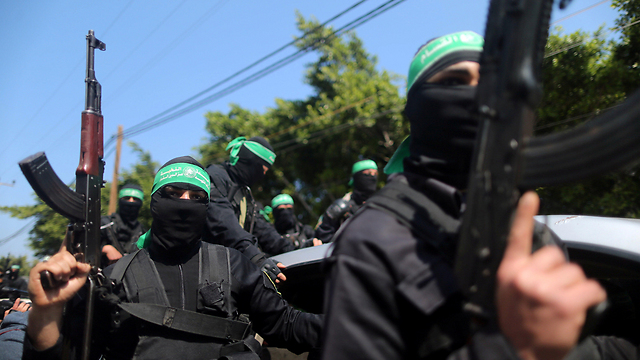 Hamas gunmen during the funeral procession (Photo: Reuters) (Photo: Reuters)