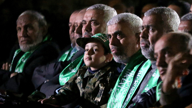 Hamas's top Gaza leadership with Fukha's son at the memorial ceremony (Photo: Reuters)